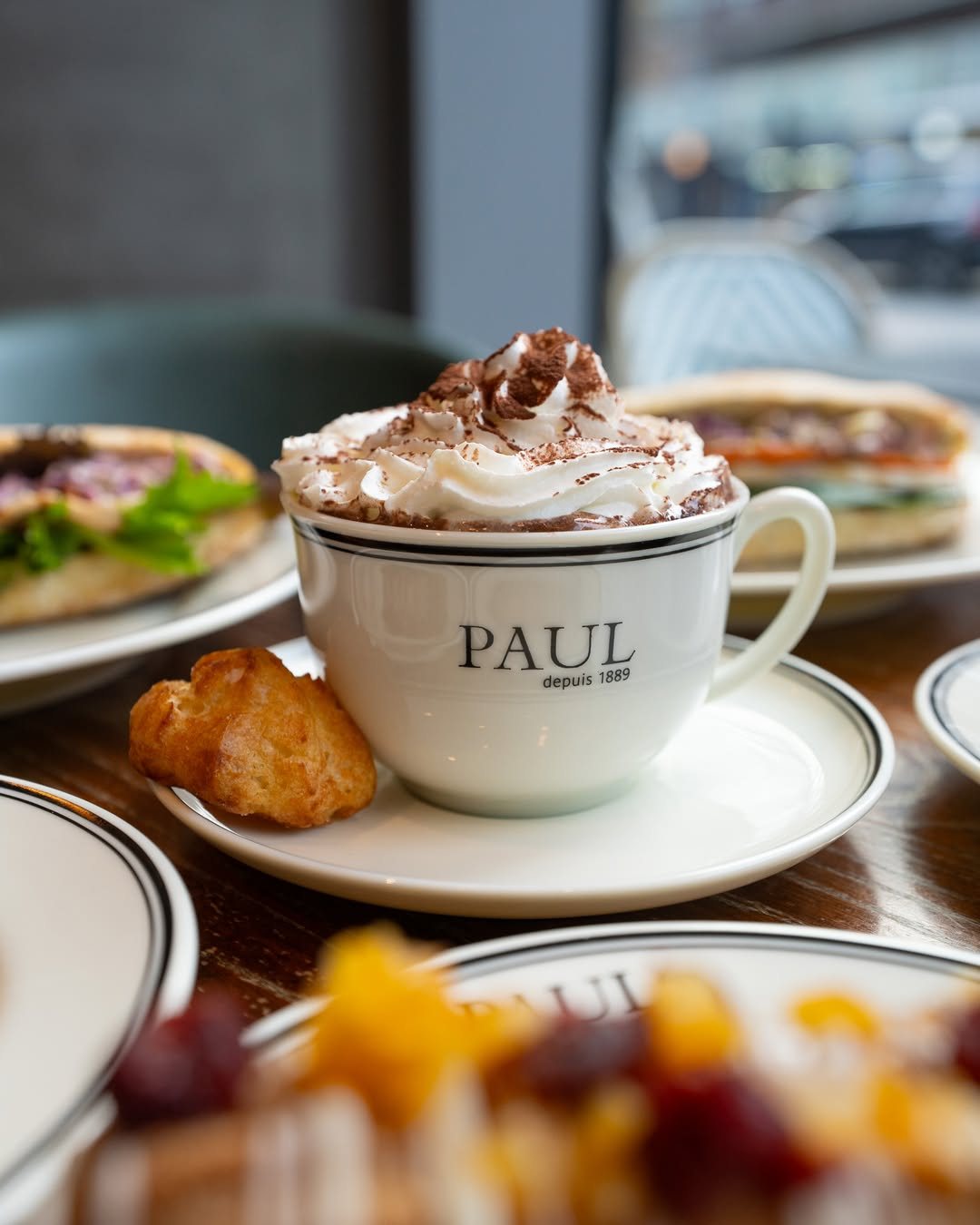 Hot chocolate with cream in a PAUL cup