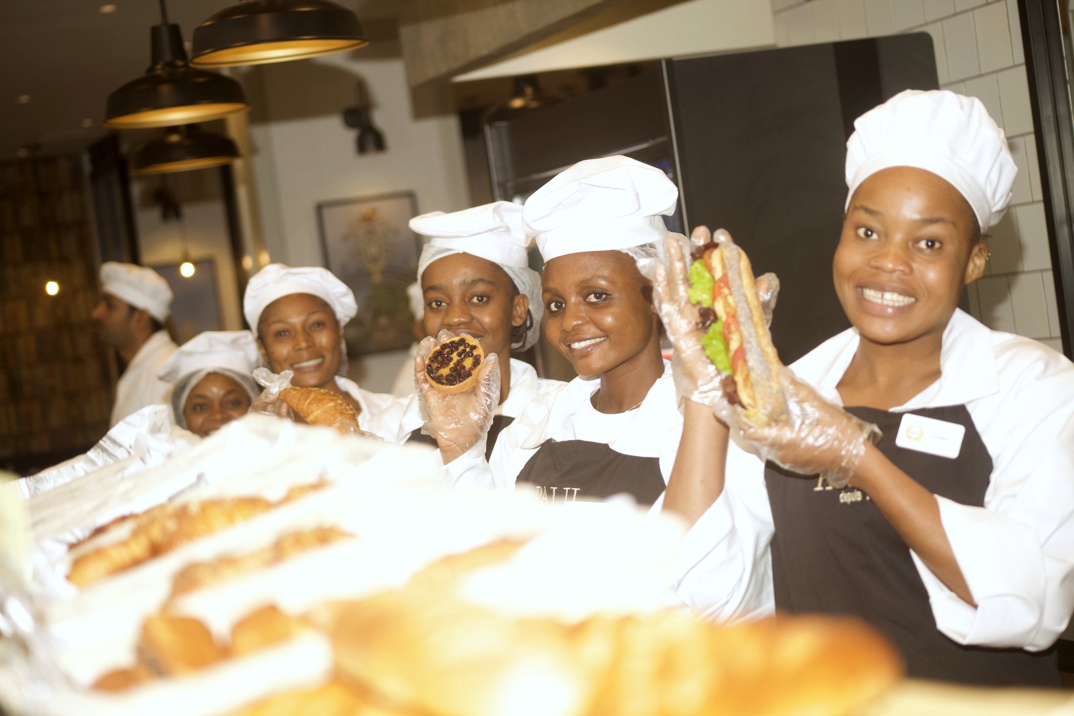 The brigade at the pastry case, smiling