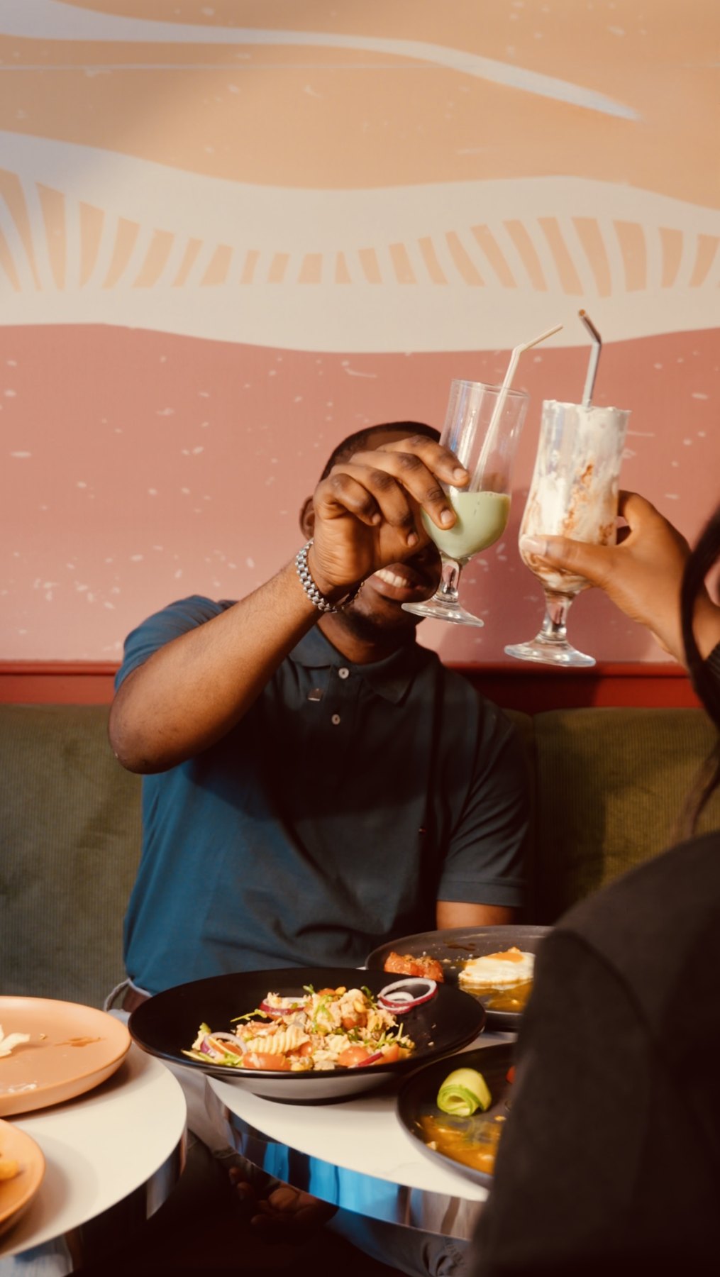 Guests raising their glasses at PAUL, Kinshasa